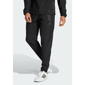 AfB_X Y JWApc {gX TIRO 25 PRO VIS TECH TRAVEL PANTS - Tracksuit bottoms - black
