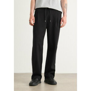{X Y T_ V[Y LEVETE - Tracksuit bottoms - black
