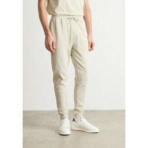 {X Y T_ V[Y SESTART - Tracksuit bottoms - light beige one