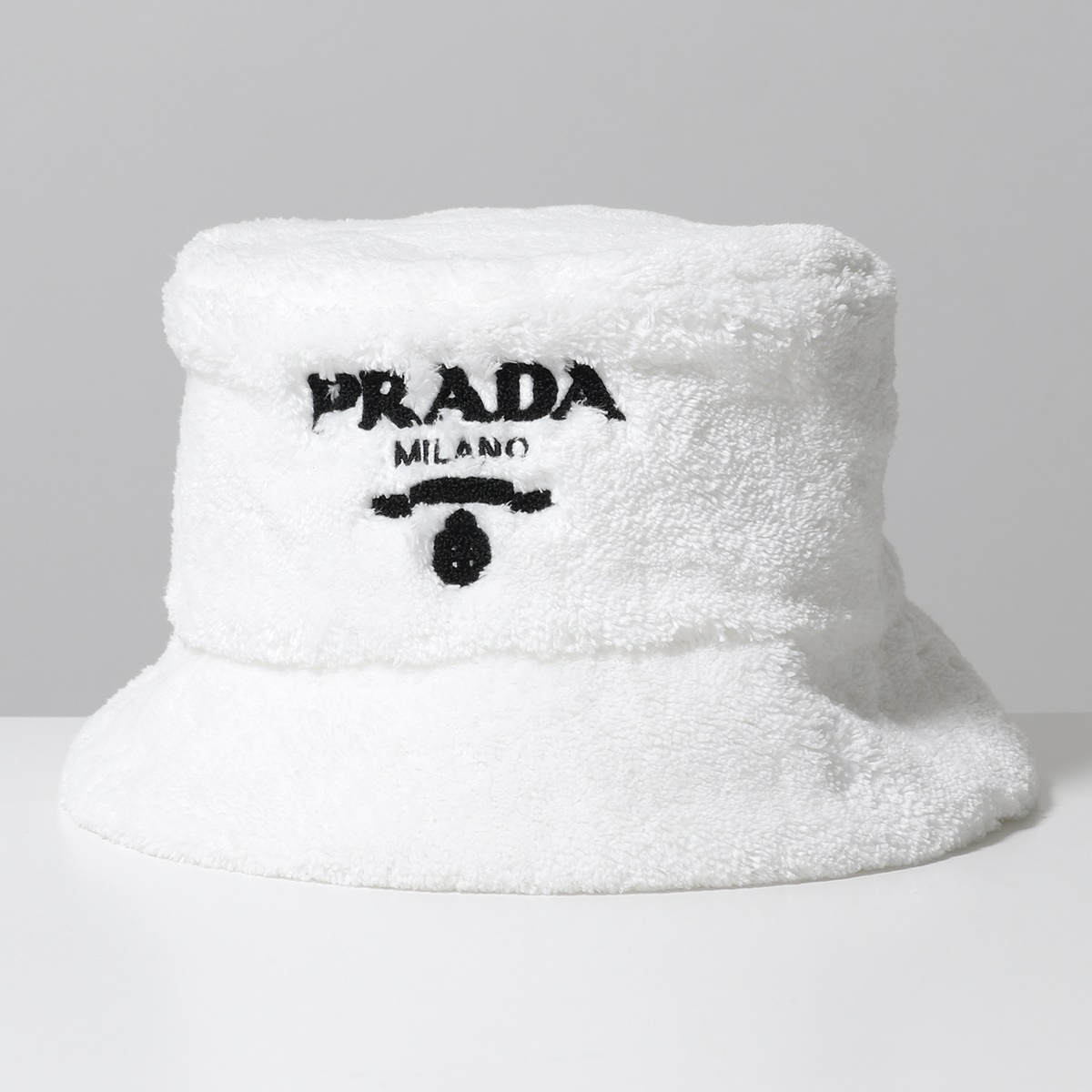PRADA プラダ バケットハット 1HC137 2DXO レディース テリークロス ファー 帽子 レタリングロゴ F0964/BIANCO+NERO  | インポートセレクト musee