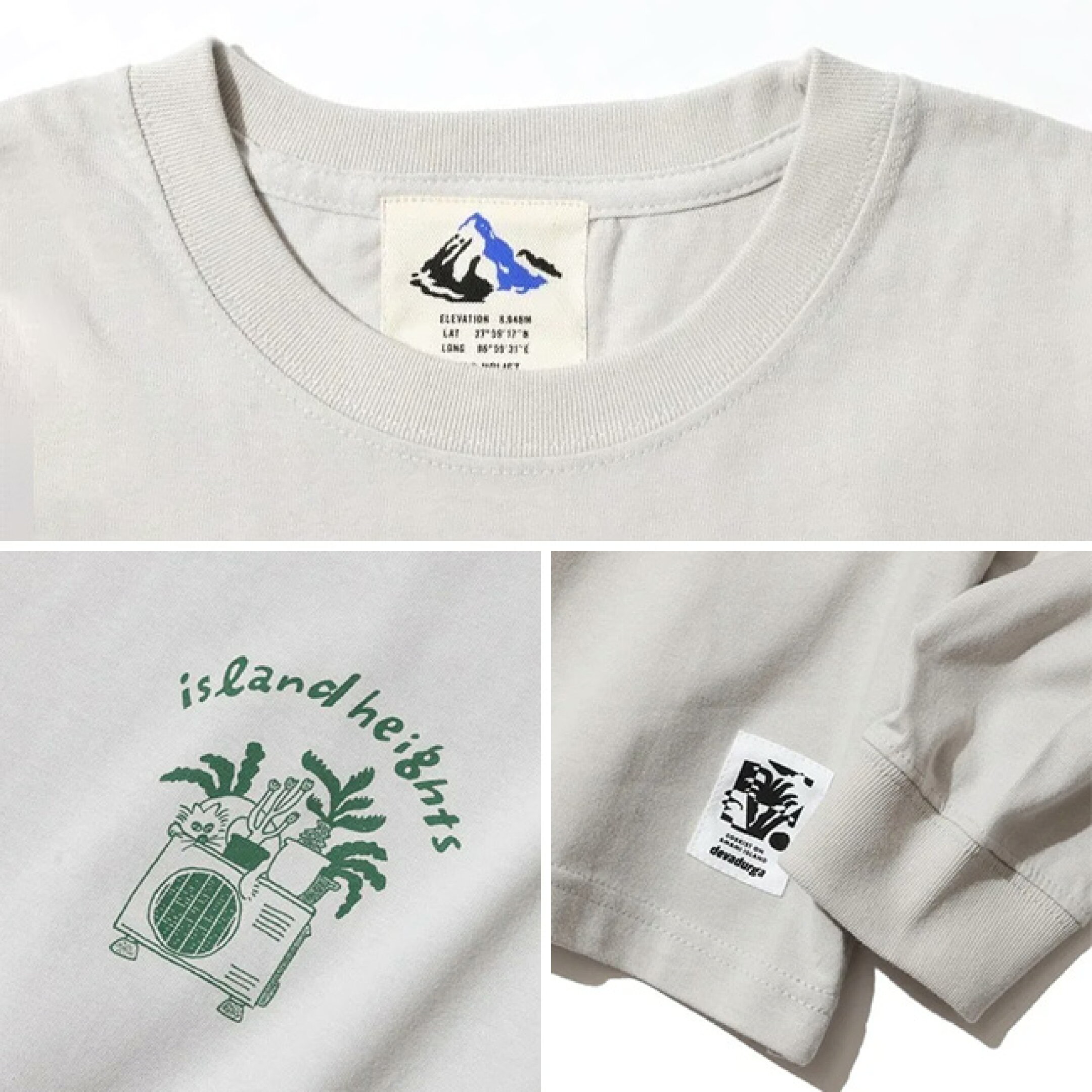 島にありそうな集合住宅イラストをバックプリントに。  左胸には室外機と猫のワンポイントイラスト。  ゆったりとしたワイドシルエットなボディーを使用し2025年のコレクションアイコンでもある、アーバングラフィックタグを左裾にパッチワーク。