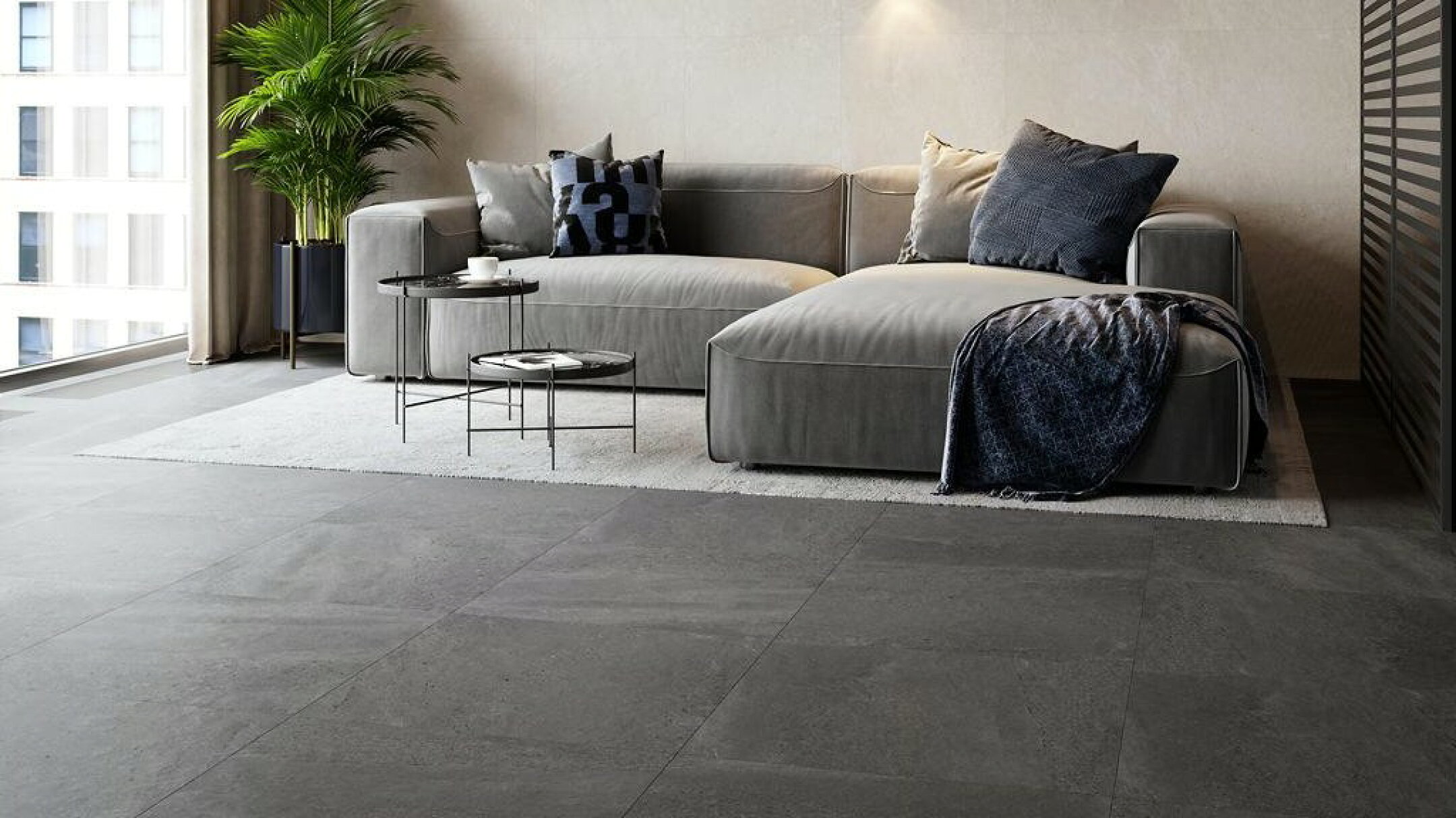 施工例：天然石風の黒の600床タイルのリビングでの使用例