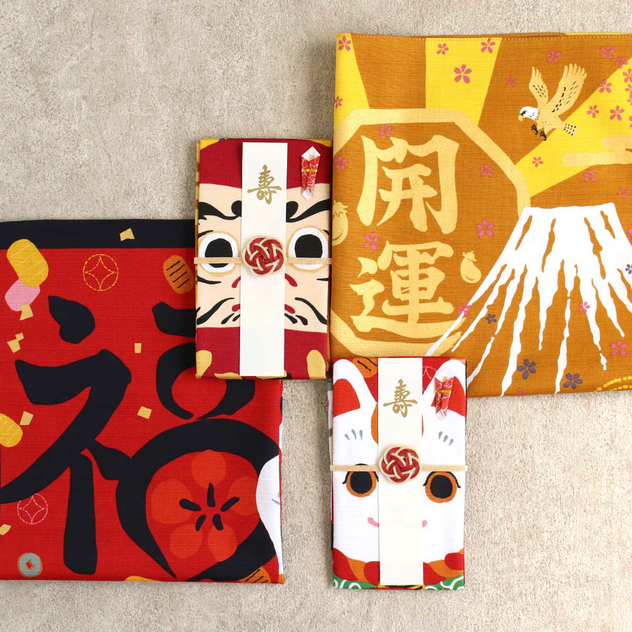 縁起物の達磨と招き猫が色彩華やかな風呂敷で作られた祝儀袋です。 贈った後は風呂敷として手元に残り、お祝いの気持ちが形としてのこる一品です。
