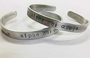 At@ JC IK Jt uXbg - ϐFȂA~jẼJtɕςȃtHgŃnhX^vĂAɃCZXĂ܂B Ann Peden Jewelry Alpha Chi Omega C