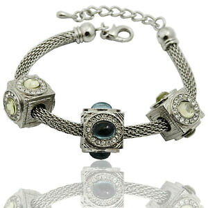 yzWG[EANZT[ Ab`CIujgVIhNAheBRNAWJ{Vub`hiwrbracciale donna snake in acciaio brunito ciondoli quadrati con quarzi caboc