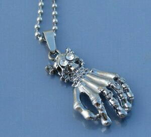 yzWG[EANZT[ ^y_glbNXnhXPgcollier metal pendentif main squelette tete de mort avec brillant neuf