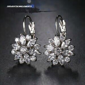 yzWG[EANZT[ XtXL[WRjECORzCgS[hbLboucles doreilles zirconium fleur petales swarovskiRelements plaque or blanc