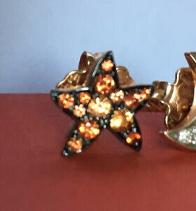 yzWG[EANZT[ XeCOIWTt@CAorecchino stella con zaffiri arancio
