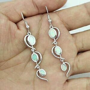 yzWG[EANZT[ Vo[X^[OzCgt@CAIp[cCXg_OI[og[CObeautiful 925 argento sterling white fire opal twist dangle orecchini a per