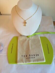 yzWG[EANZT[ xCJ[lCNX^NEk[hS[hy_gpbNted baker chiione cristallo corona ciondolo oro nudo nuovo in confezione