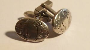 yzYANZT?@JtNXVo[[tcufflinks silver oval shaped engraved with two leaves in each boxed
