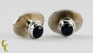 yzYANZT?@Tt@CAJ{VJtXNZbgsapphire cabochon cufflinks set in silvercolored metal