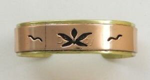 yzuXbg@ANZT?@tFb`[^XJtuXbgfar fetched copper amp; brass cutout lotus cuff bracelet