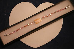 yzuXbg@ANZT?@mopsN85C`beautiful bracelet with mop and pink freshwater pearls 85 inches long in box