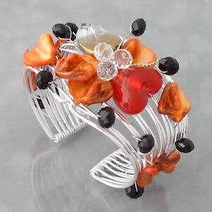 yzuXbg@ANZT?@IWJtorange dyed sea shells amp; crystals flower wired cuff
