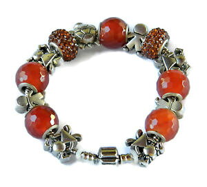 �y���������z�u���X���b�g�@�A�N�Z�T��?�@�J�l�I�����W�u���X���b�gsectional bracelet with stones carnelian and orange rhinestones