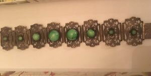 �y���������z�u���X���b�g�@�A�N�Z�T��?�@�O���[���K���X�u���X���b�garticulated old bracelet with green glass pastes