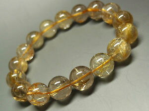 yzuXbg@ANZT?@``^Ehr[YuXbgnatural gold rutilated quartz titanium round beads bracelet 125mm aaa