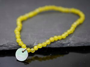 �y���������z�u���X���b�g�@�A�N�Z�T��?�@�u���X���b�g�r�[�Y�p�[��bracelet with yellow beads and mother of pearl charmstretchy