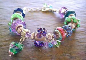 yzuXbg@ANZT?@Z[[bpr[YuXbg}`J[r[Y european bead bracelet multicolor blues, greens, purple large hole beads