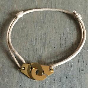 yzC^A@uXbg@uXbgX[RhRgx[Wle bracelet tendance les menottes sur cordon coton reglable beige en acier dor