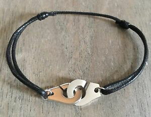 �y���������z�C�^���A���@�u���X���b�g�@�u���X���b�g�V�����R���h���h�R�g���m���[���A���W�F���gbracelet menottes sur cordon de coton reglable noir en acier argent breloque