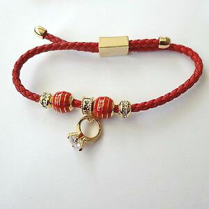 yzC^A@uXbg@JtS[hy_gOzCgbracciale donna pelle rossa inserti c oro anello pendente zirconi bianchi 12 r