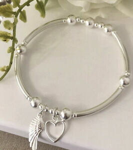 yzANZT[@lbNXX^[OVo[Xgb`n[guXbgpulsera de apilamiento de estiramiento de plata esterlina corazn ala de ngel por encantado 925