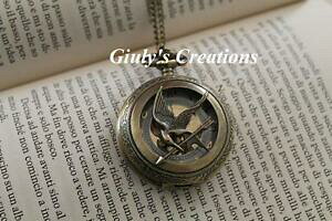 �y���������z�A�N�Z�T���[�@�l�b�N���X�l�b�N���X�Q�[���W�F�Ccollar reloj grande funciona inspirado hunger games katniss jay