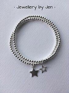 yzANZT[@lbNXX^bLOnhChAJEguXbgX^[OVo[Xgb`pulseras de apilamiento de estiramiento de plata esterlina con cuentas con estrella