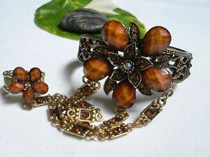 yzANZT[@lbNX@uXbgOAeB[NS[hX[uuEt[CXg[donna metallo bling braccialetto anello oro antico schiava marrone fiore strass
