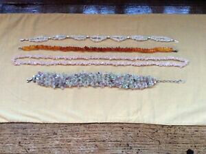 yzANZT[@lbNX@Jbg`bvlbNXAo[AWXgquattro collane di naturale uncut gemstone chipsquarzo, ambra e ametista