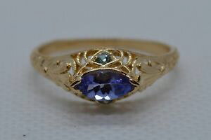 yzlbNX@^UiCgJbgOCG[S[hTCYmarquise cut tanzanite amp; green gemstone ring set in 14ct yellow gold size r 12