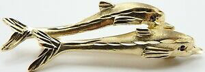 yzlbNX@CG[S[hu[`ZbgCJO9ct yellow gold brooch 2 leaping dolphins with gem set eyes weighs 69 grams