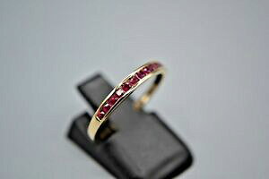 yzlbNX@S[hr[O9ct gold ruby half eternity ring