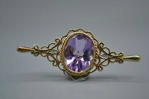 yzlbNX@S[hAWXgu[`9ct gold amp; amethyst brooch
