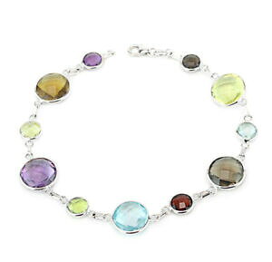 yzlbNX@14kzCgS[hmulti8C`14k white gold bracelet with round shaped multicolored gemstones 8 inches