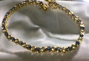 yzlbNX@^UiCgWRejXuXbgX^[OVo[S[hTCY55 ct, tanzanite and zircon tennis bracelet, gold on sterling silver, size 75