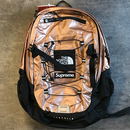 gold supreme north face backpack