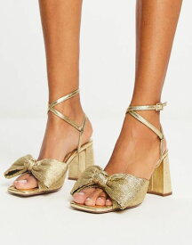 【送料無料】 エイソス レディース サンダル シューズ ASOS DESIGN Hitched bow detail mid heeled sandals in gold GOLD