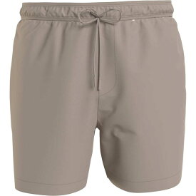 【送料無料】 カルバンクライン メンズ ハーフパンツ・ショーツ 水着 Medium Tape Swim Shorts Mens Beige