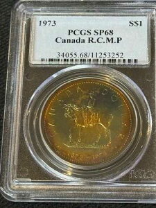 C320 �J�i�_ 1973 �N �V���o�[ �_���[ R.C.M.P. �Z���e�j�A�� KM-83 PCGS SP68 ���ꂢ�ȐF���ł��B