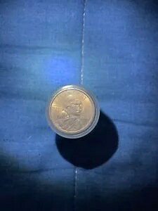 �������j������̂���S�[���h�� $1 �R�C��