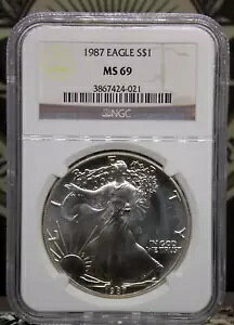 1987 �A�����J�� �V���o�[ 1�I���X �C�[�O�� $1 NGC MS69 #021 BU ���C�݃R�C�� & ���W�i