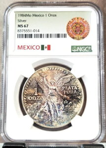 1984�N ���L�V�R �V���o�[ ���x���^�b�h 1 �I���U NGC MS 67 ���Ƀ��C���h�ȃJ���[�g�[��