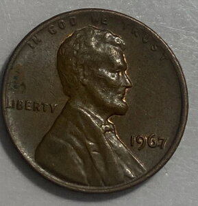 ��?1967�N�����J�[���y�j�[�A�~���g�}�[�N�G���[�Ȃ��A���ɁuL�v�ƁuWE TRUST�v