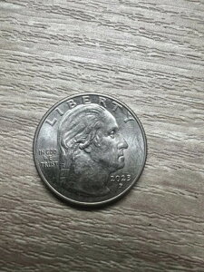 2023NPxbV[ER[}̊󏭂25Zgd݂ɁuIn Cod We Trustv̌肪B̑