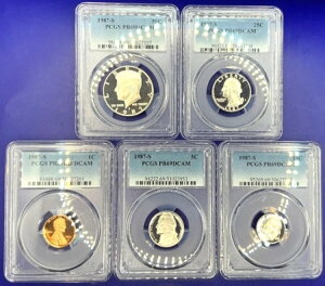 1987-S �v���[�t�Z�b�g 5���Z�b�g �R�C�� �V�i�Ӓ�ς� PCGS PR69 DCAM �M�t�g�ɍœK